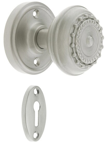 Classic Rosette Mortise Lock Set With Meadows Design Knobs in Satin Nickel finish.